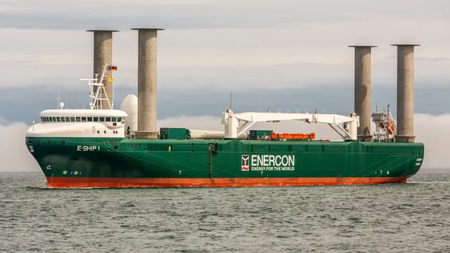 Wind-assisted cargo ship E-Ship 1 operating with four Flettner rotor sails on open ocean water